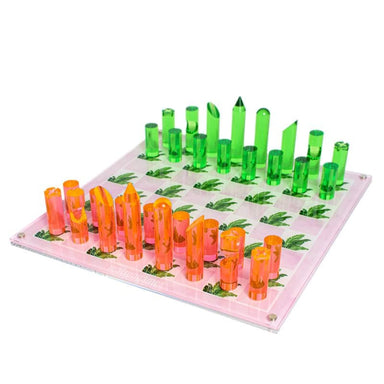 acrylic chess set with a beverly hills design with pieces in orange and green diagonal view