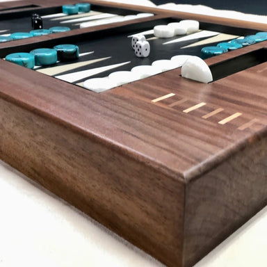 luxury backgammon board made with wood and leather with white a and turquoise checkers right corner view