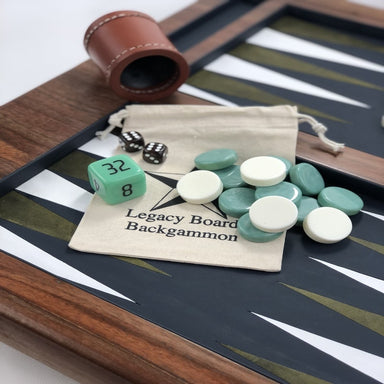 luxury wooden backgammon board close up view of white and light green checkers and dices